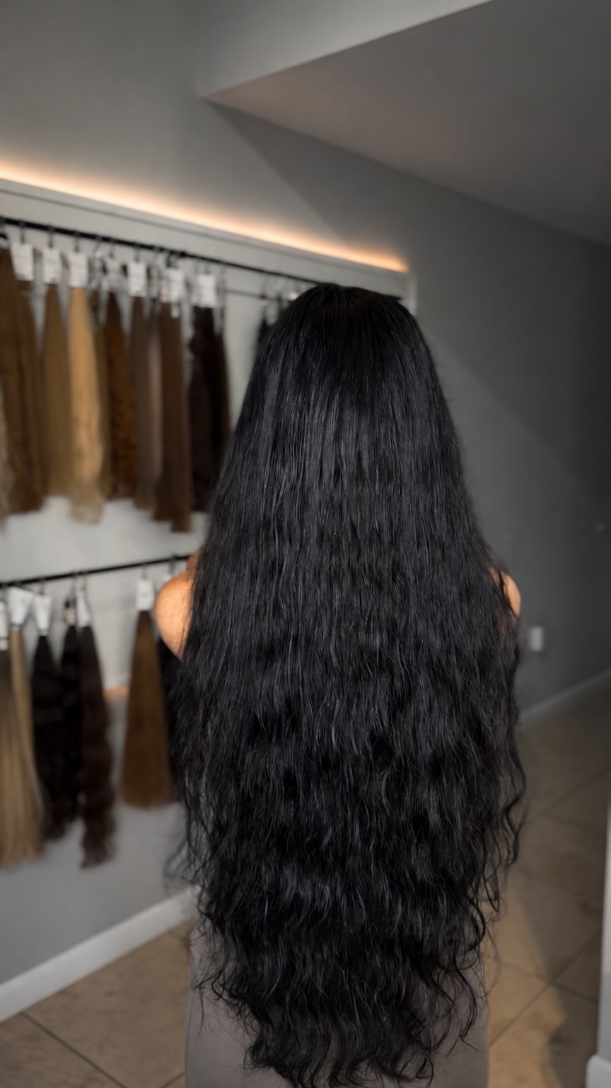 Long black waves created with 28-inch, 200-gram premium hair extensions at Vizavi Beauty in Midtown Miami